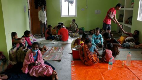 People rest at a shelter Tuesday after evacuating their houses in coastal areas in the eastern state of West Bengal, India.