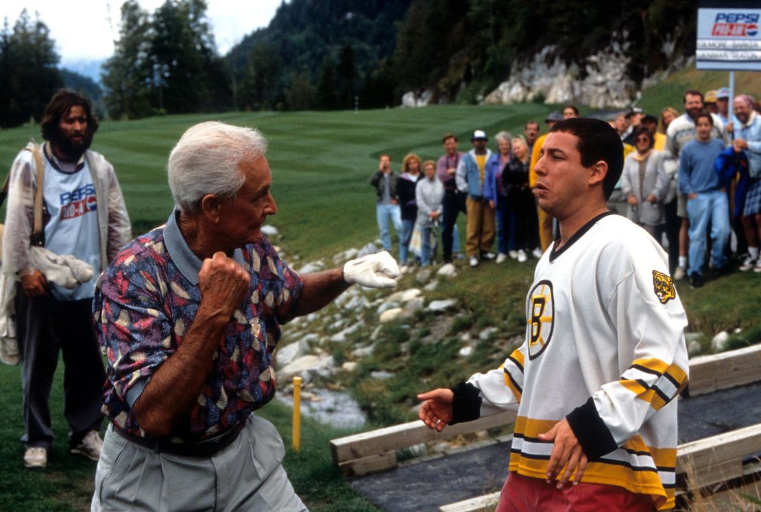 Bob Barker prepares to punch Adam Sandler in a scene from the film 'Happy Gilmore,' 1996. 