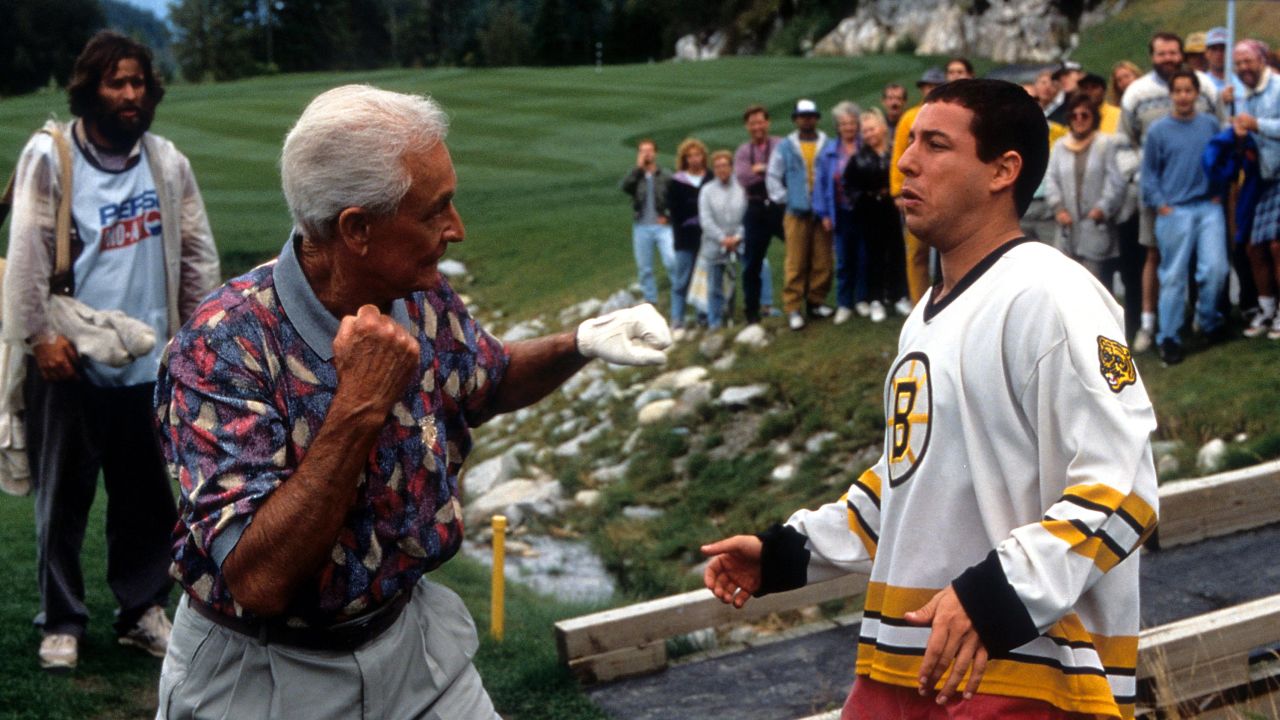 Bob Barker prepares to punch Adam Sandler in a scene from the film 'Happy Gilmore,' 1996. 