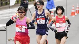 Mizuki Matsuda (74) and Ayuko Suzuki (72) compete in a half-marathon race being held amid the coronavirus pandemic at the venue of the Tokyo Olympics marathon as a test event in the northern Japan city of Sapporo on May 5, 2021. Suzuki will represent Japan at the Tokyo Olympics women's marathon. (Photo by Kyodo News via Getty Images)