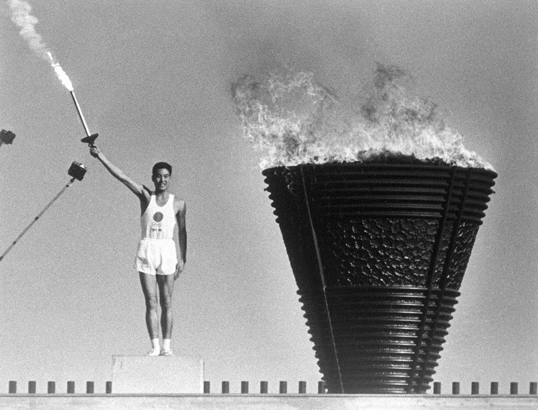The cauldron is lit during the opening ceremony of the Tokyo Olympics on October 10, 1964. 