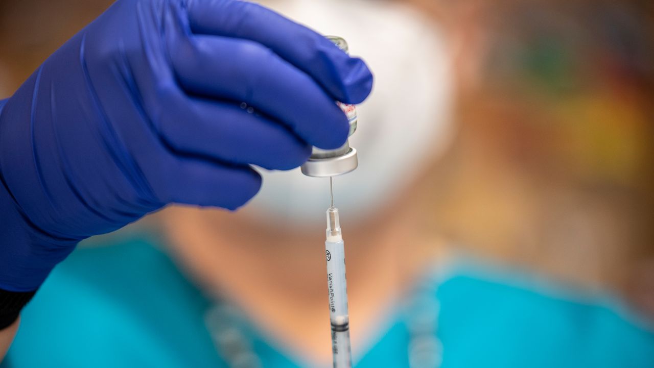 A nurse fills up a syringe with the Moderna COVID-19 vaccine at a vaccination site at a senior center on March 29, 2021 in San Antonio, Texas.