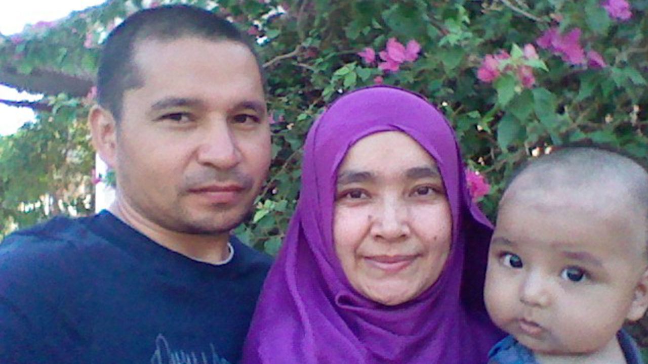 Maryam Muhammad, her child and her husband, Muhtar Rozi, who disappeared during a crackdown on Uyghur Muslims in Egypt. 