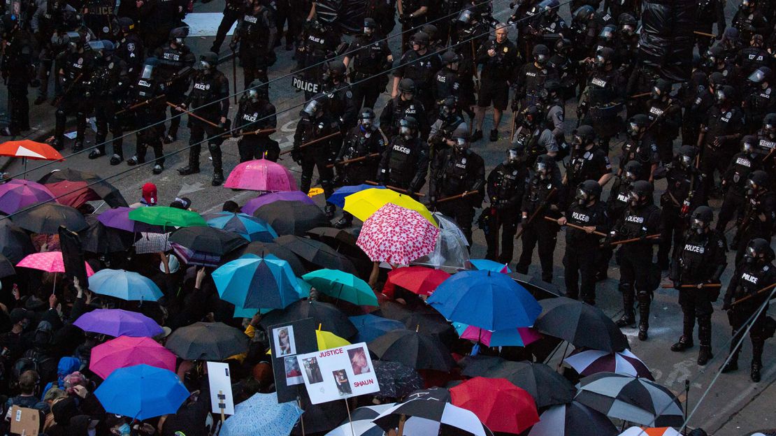 Demonstrators face off with police near the Seattle Police Departments East Precinct in June 2020.