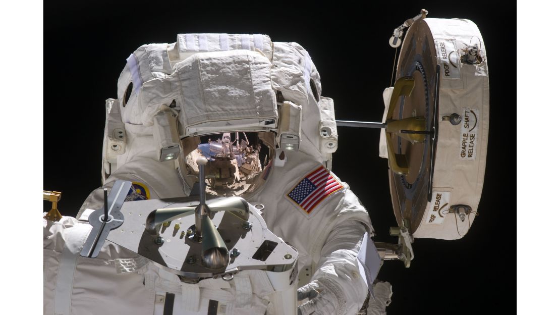 Fincke is pictured during one of his spacewalks in 2011, which lasted for seven hours and 24 minutes.