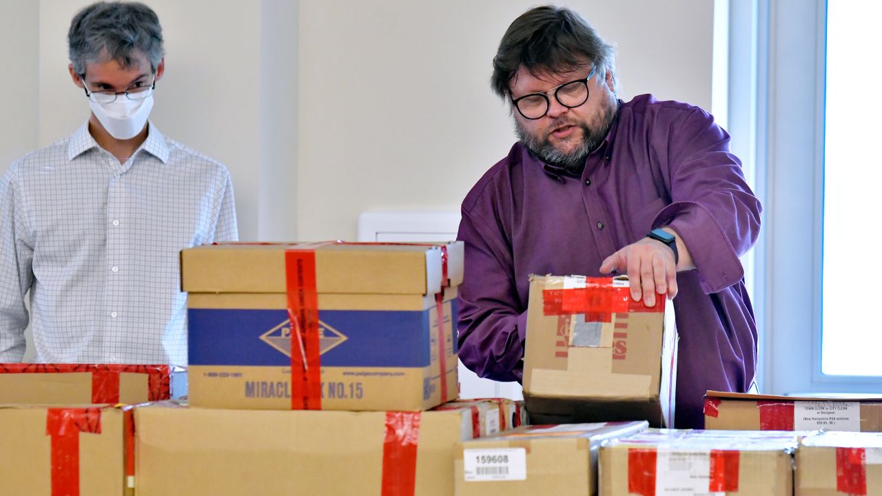 Election auditors Mark Lindeman, and Harri Hursti catalog ballot boxes Tuesday, May 11, 2021, in Pembroke, N.H., after they arrived at the site of a forensic audit of a New Hampshire legislative election. 