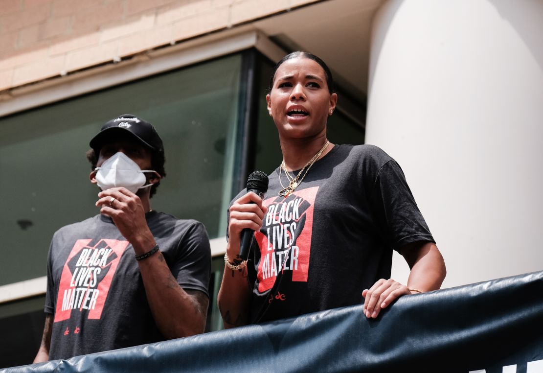 Natasha Cloud and Bradley Beal speak at a Juneteenth rally to raise awareness for social justice issues on June 19, 2020 in Washington, DC.