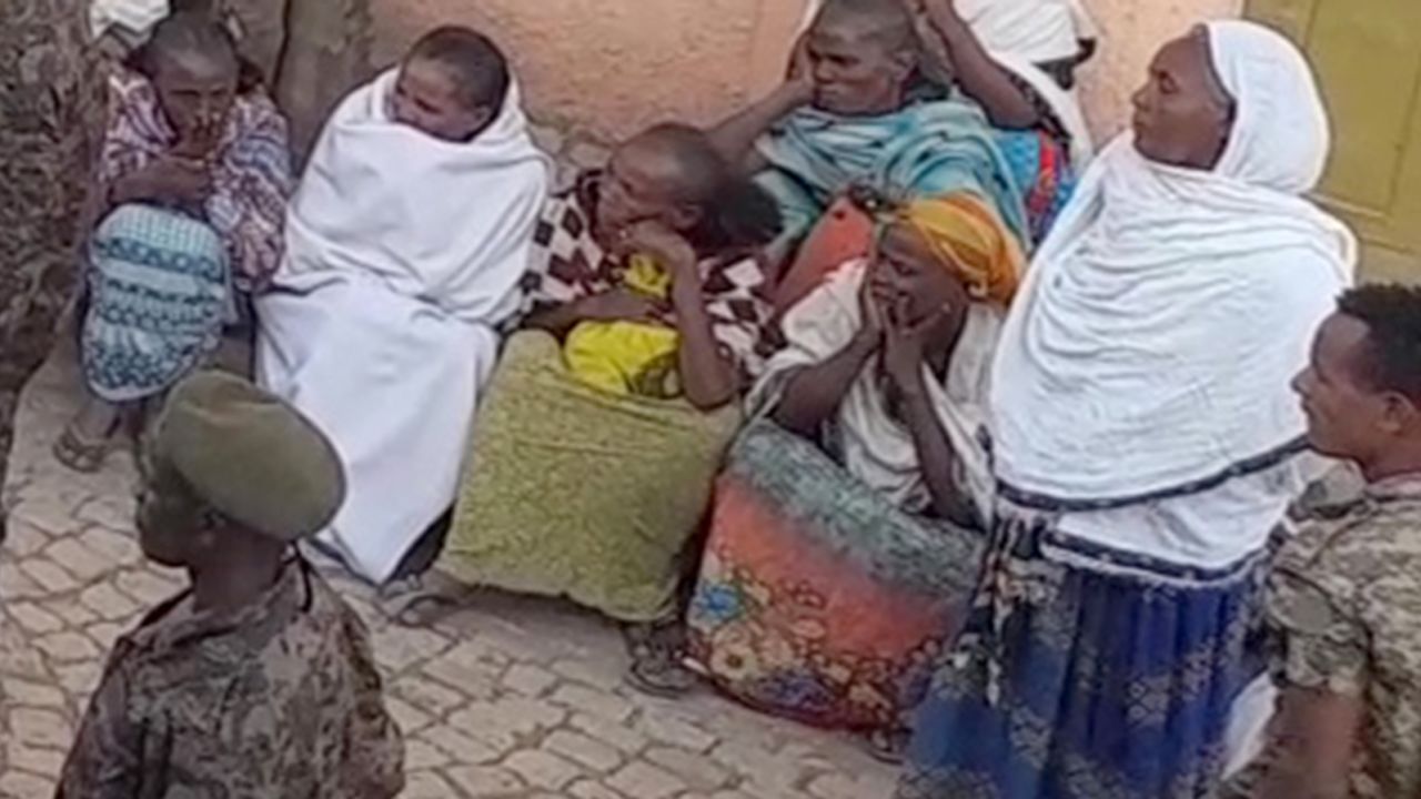 A screenshot from video obtained by CNN shows Ethiopian soldiers addressing families inside the UNHCR compound awaiting word of their loved ones.