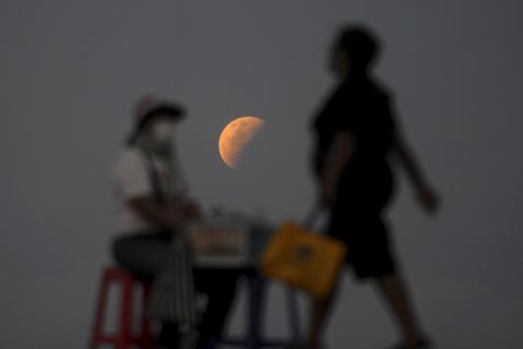 The moon is seen near the Indonesian island of Bali during Wednesday's total lunar eclipse.