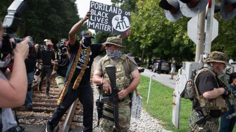 Members of far-right militias and White pride organizations rally near Stone Mountain Park in 2020. 