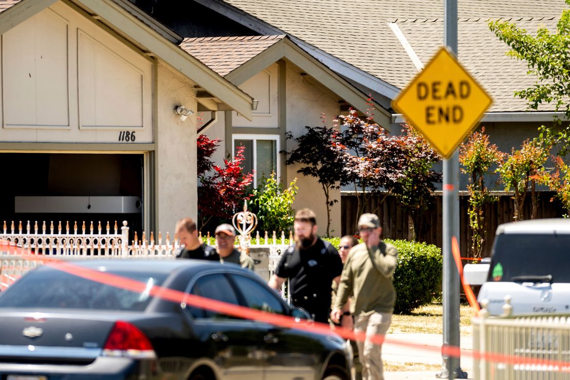 Emergency responders leave a home, rear, being investigated in connection to the shooting on Wednesday in San Jose.