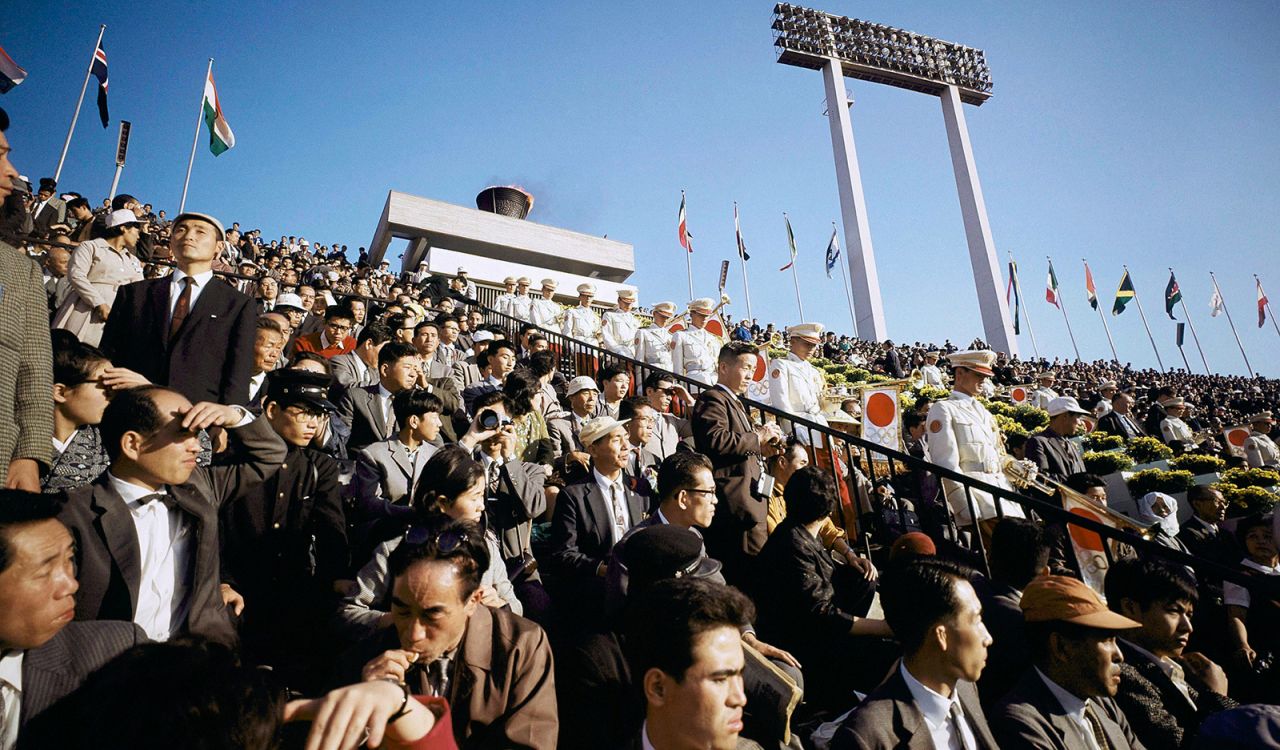 People attend the opening ceremony of the 1964 Tokyo Olympics.