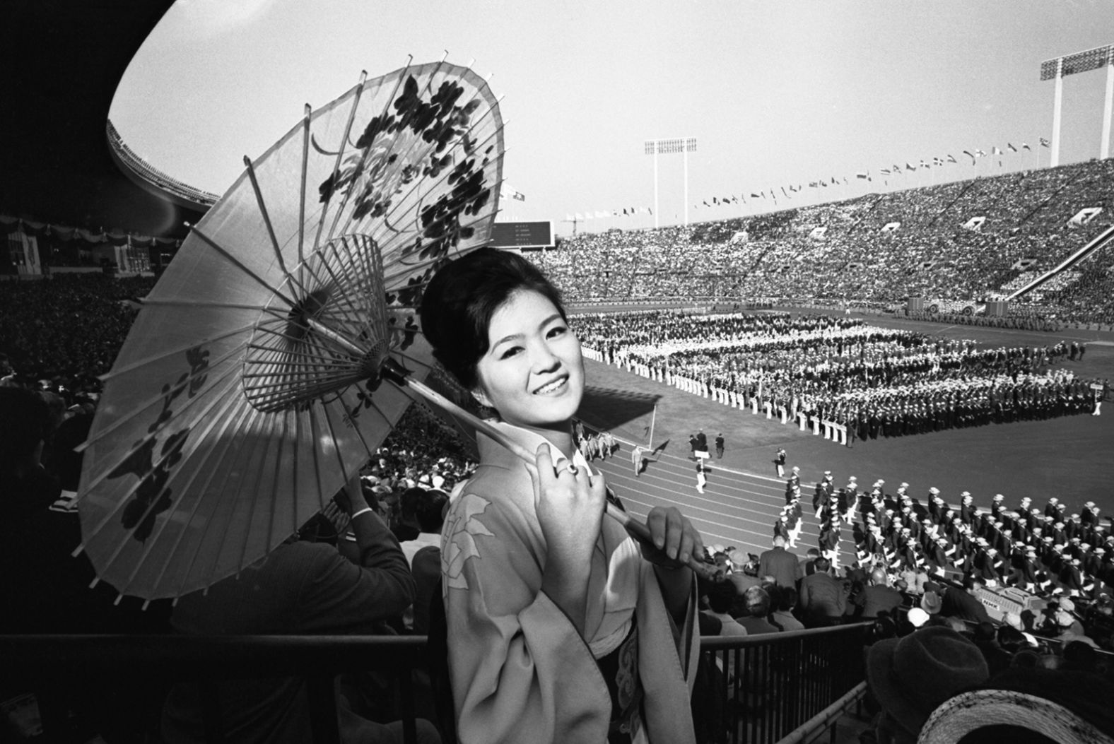 A woman wears traditional clothing at the opening ceremony on October 10, 1964.