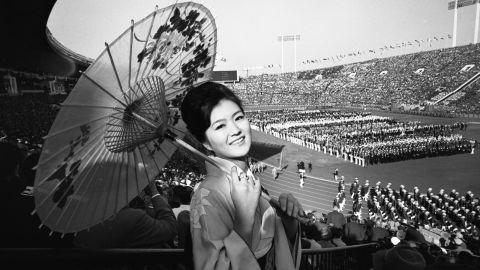 A woman wears traditional clothing at the opening ceremony on October 10, 1964.