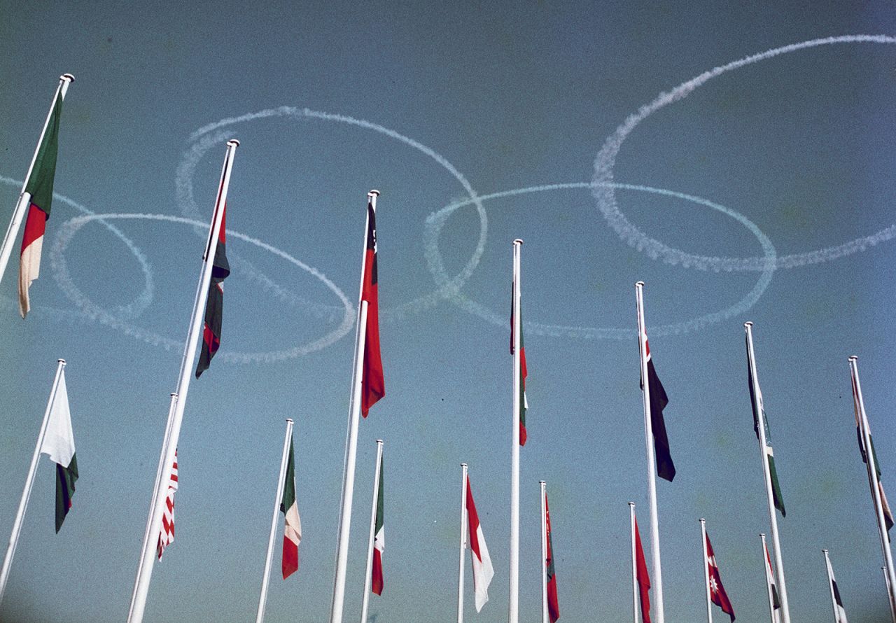 The Olympic rings are drawn in the sky by Blue Impulse, the Japanese Air Force's aerobatics team, during the opening ceremony.