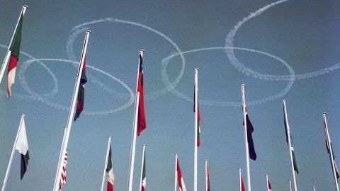 The Olympic rings are drawn in the sky by Blue Impulse, the Japanese Air Force's aerobatics team, during the opening ceremony.