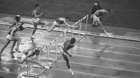 Athletes clear the last hurdle in the 110-meter event. American Hayes Jones, bottom right, won the gold.