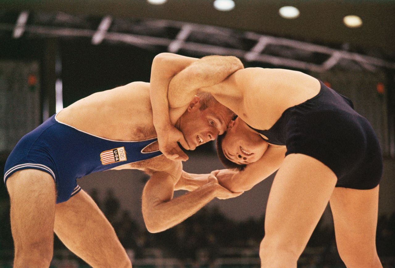 American wrestler Gregory Ruth, left, takes on Mongolia's Sereeter Danzandarjaa.