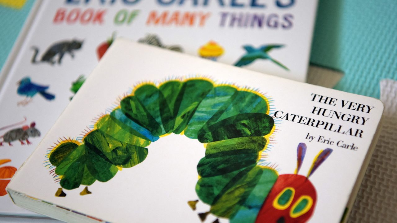 This photo illustration taken on May 26, 2021, shows Eric Carle's "The Very Hungry Caterpillar" and "Book of Many Things" in Los Angeles, California.