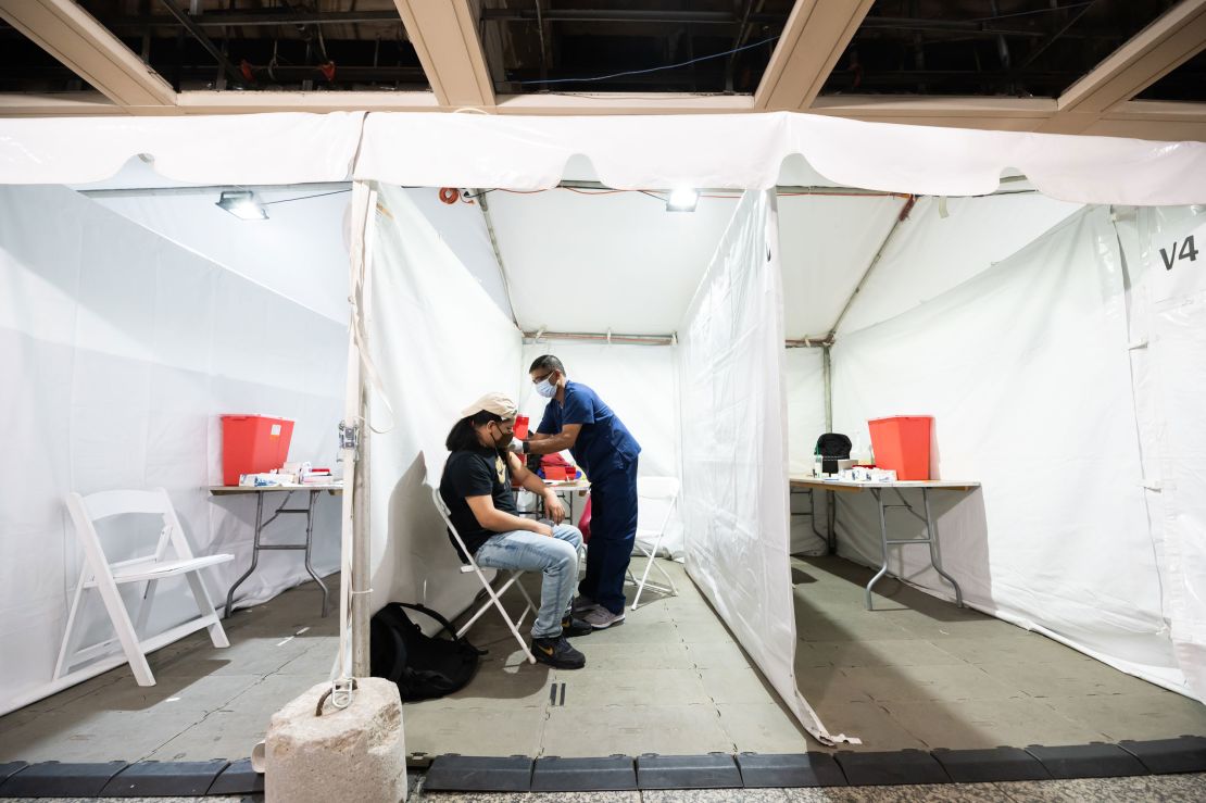 A person gets vaccinated against Covid-19 in Penn Station on May 26, 2021 in New York City. 