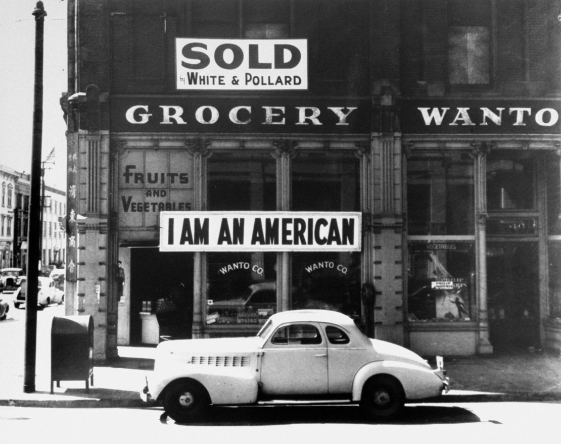 A sign reading: 'I AM AN AMERICAN', on the Wanto Co grocery store in Oakland, California, the day after the attack on Pearl Harbor, 8th December 1941. 
