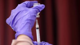 Nurses draw vaccine doses from a vial as Maryland residents receive their second dose of the Moderna coronavirus vaccine at the Cameron Grove Community Center on March 25, 2021 in Bowie, Maryland. 