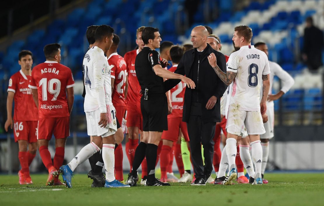 Zidane interacts with referee Juan Martinez Munuera after the La Liga match between Real Madrid and Sevilla.