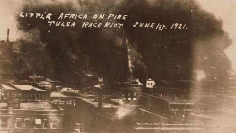 The Greenwood District burns during the mob violence on June 1, 1921.