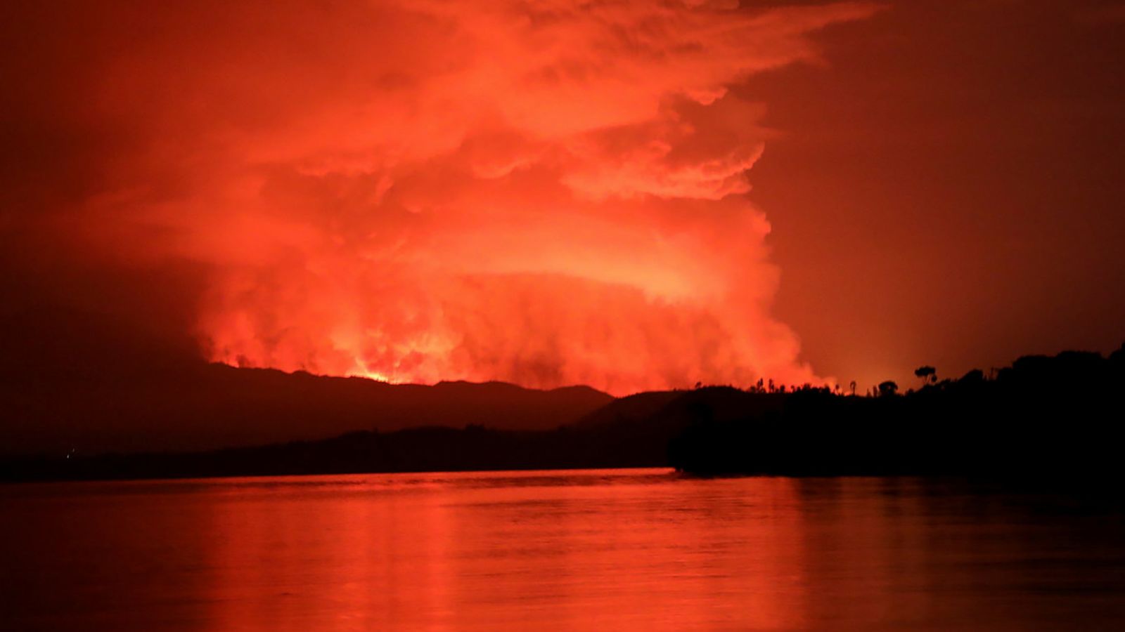 The volcano's smoke and flames are seen from Tchegera Island on Lake Kivu, near Goma, on May 22.