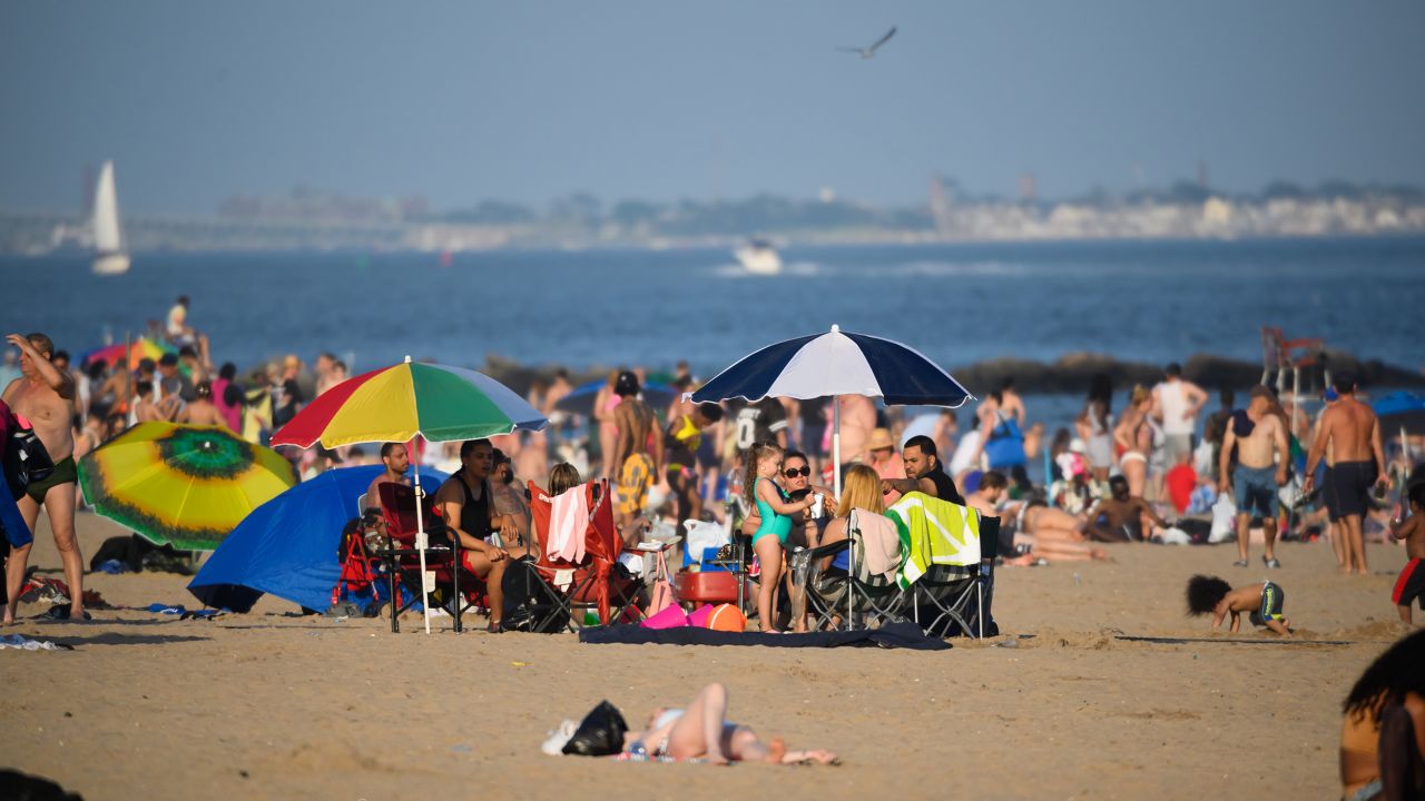 People fill Brighton Beach in New York's Coney Island in July 2020.
