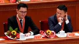 Alibaba's co-founder Jack Ma (R) looks at Tencent Holdings' CEO Pony Ma during a government celebration meeting marking the 40th anniversary of China's "reform and opening up" policy at the Great Hall of the People in Beijing on December 18, 2018.