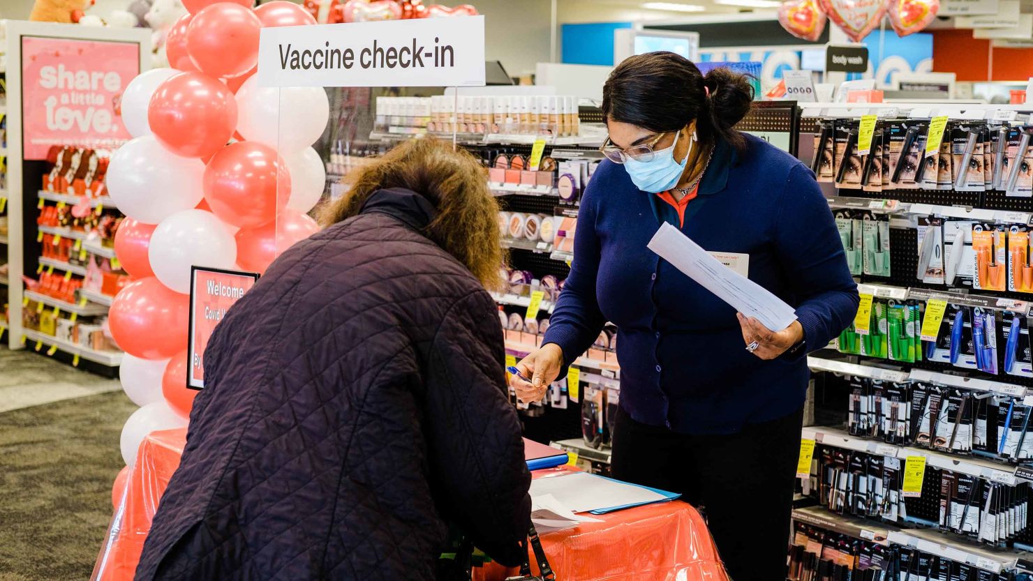 A person gets checked in to receive a Covid-19 vaccine at a CVS Pharmacy location in Eastchester, New York.