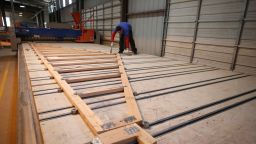 A worker assembles a truss for a home at Wasatch Truss on May 12, 2021 in Spanish Fork, Utah. Lumber prices have sky rocketed along with supply shortages the last several months have plagued the construction industry. (Photo by George Frey/Getty Images)