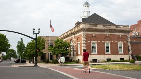 A man walks by the Greater Dalton Camber of Commerce.