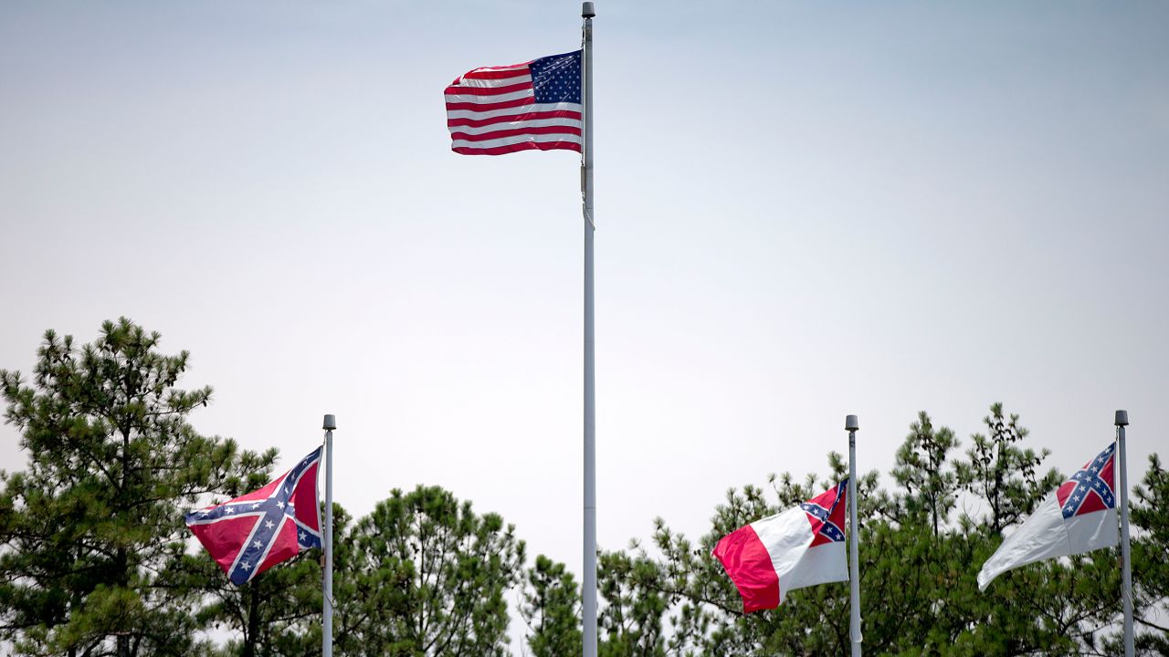 A Confederate flag, at left, flies at the base of Stone Mountain Park.