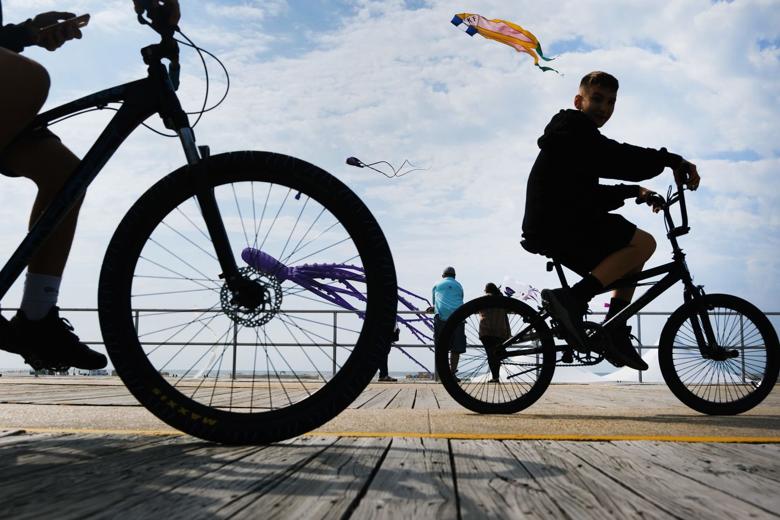 People enjoy the boardwalk Friday in Wildwood, New Jersey.