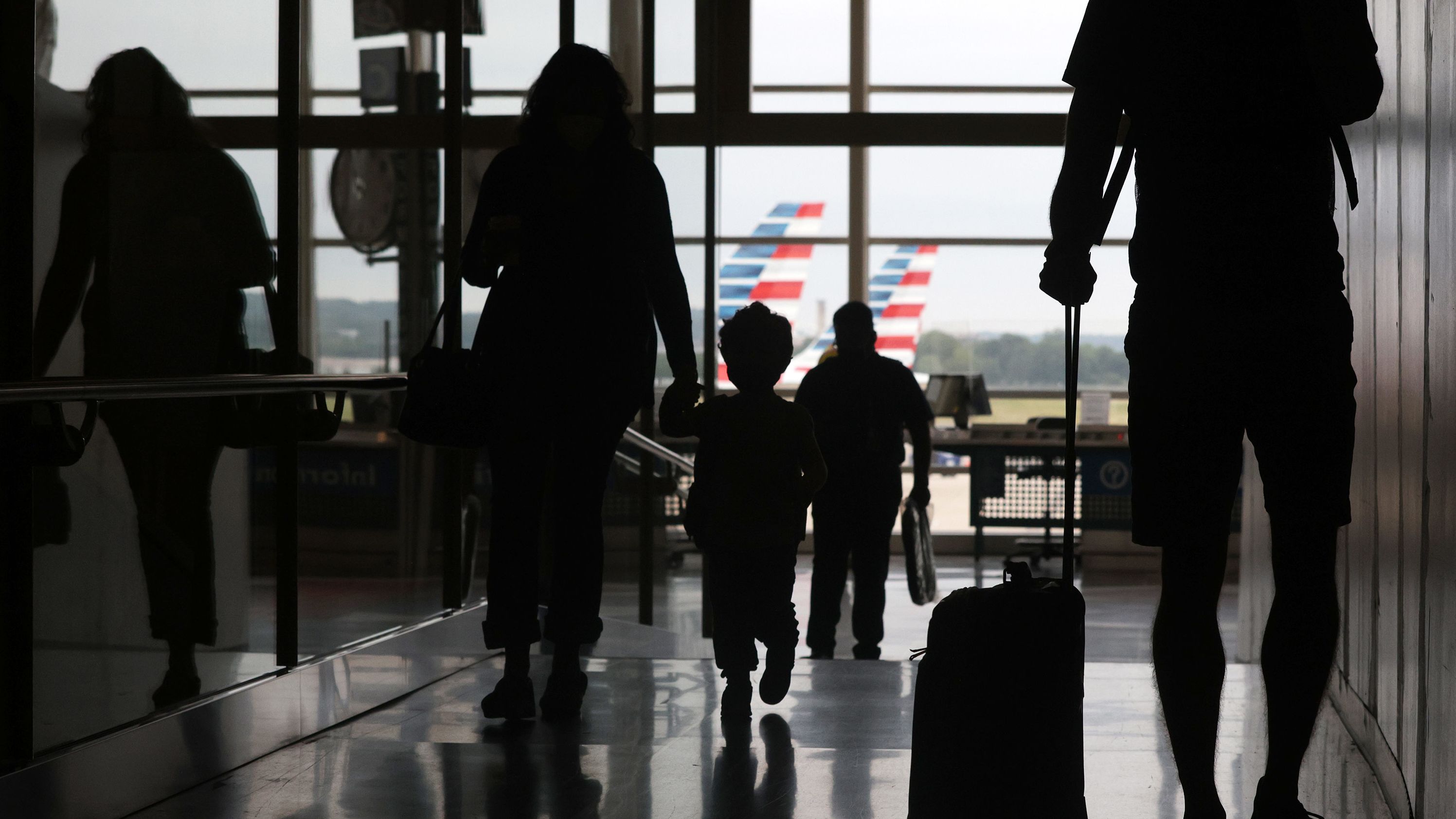 Travelers pass through the concourse Friday at Ronald Reagan Washington National Airport in Arlington, Virginia.