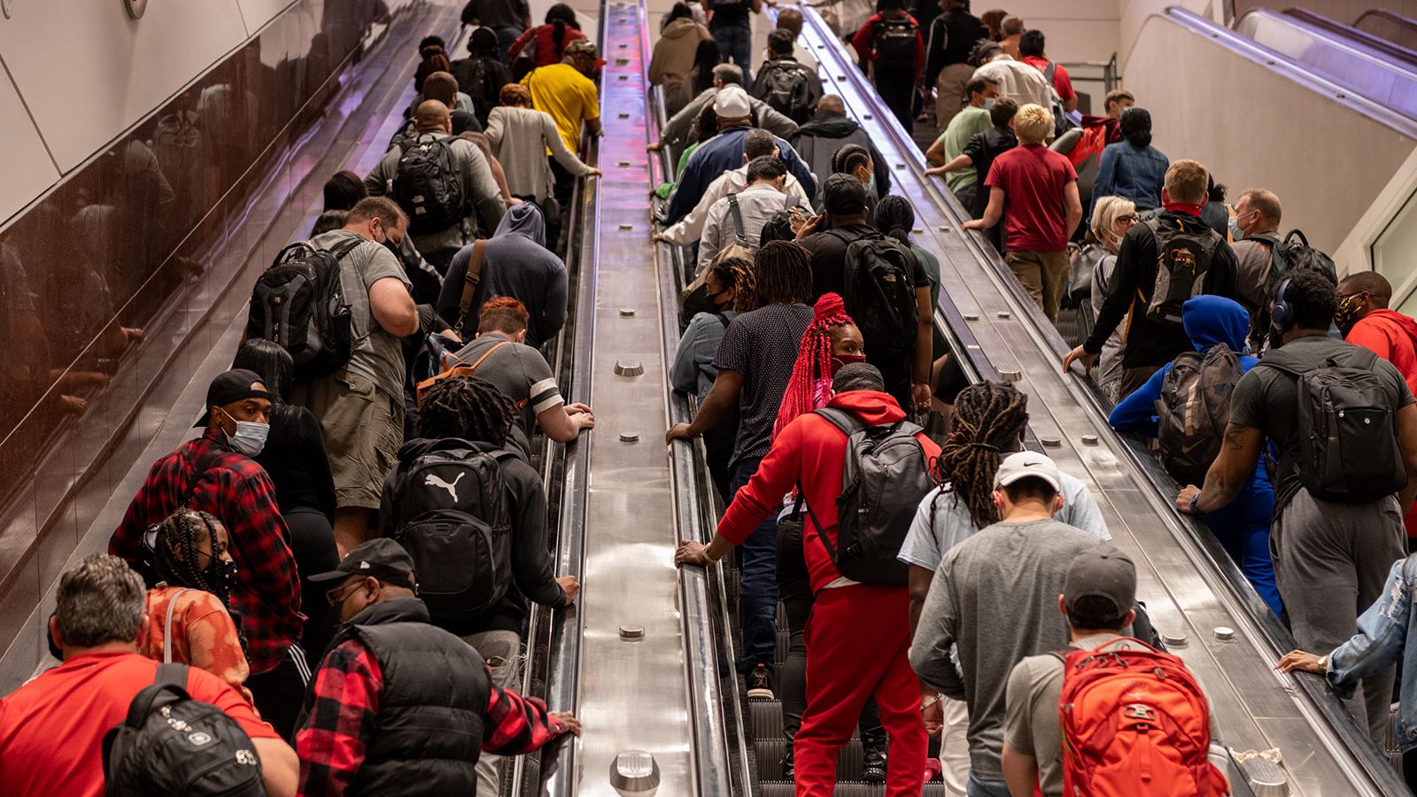 People ride escalators at Atlanta's Hartsfield-Jackson International Airport on Friday, May 28.