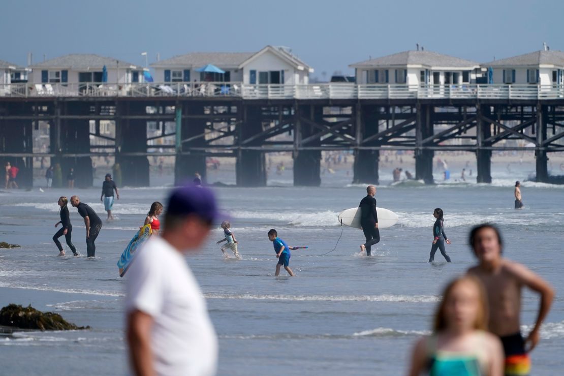 People visit a beach ahead of Memorial Day weekend on Friday in San Diego, California.