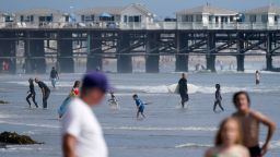 People visit the beach ahead of Memorial Day weekend on May 28 in San Diego, California.