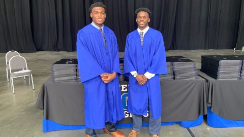 Centennial High School students Evan Walker, left, and Jordan Barbas, right, received the Centennial High School African American Football Scholar Athlete Scholarship.