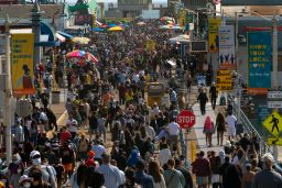 People crowd the Santa Monica Pier in Santa Monica, California, on Saturday, May 29, 2021. 