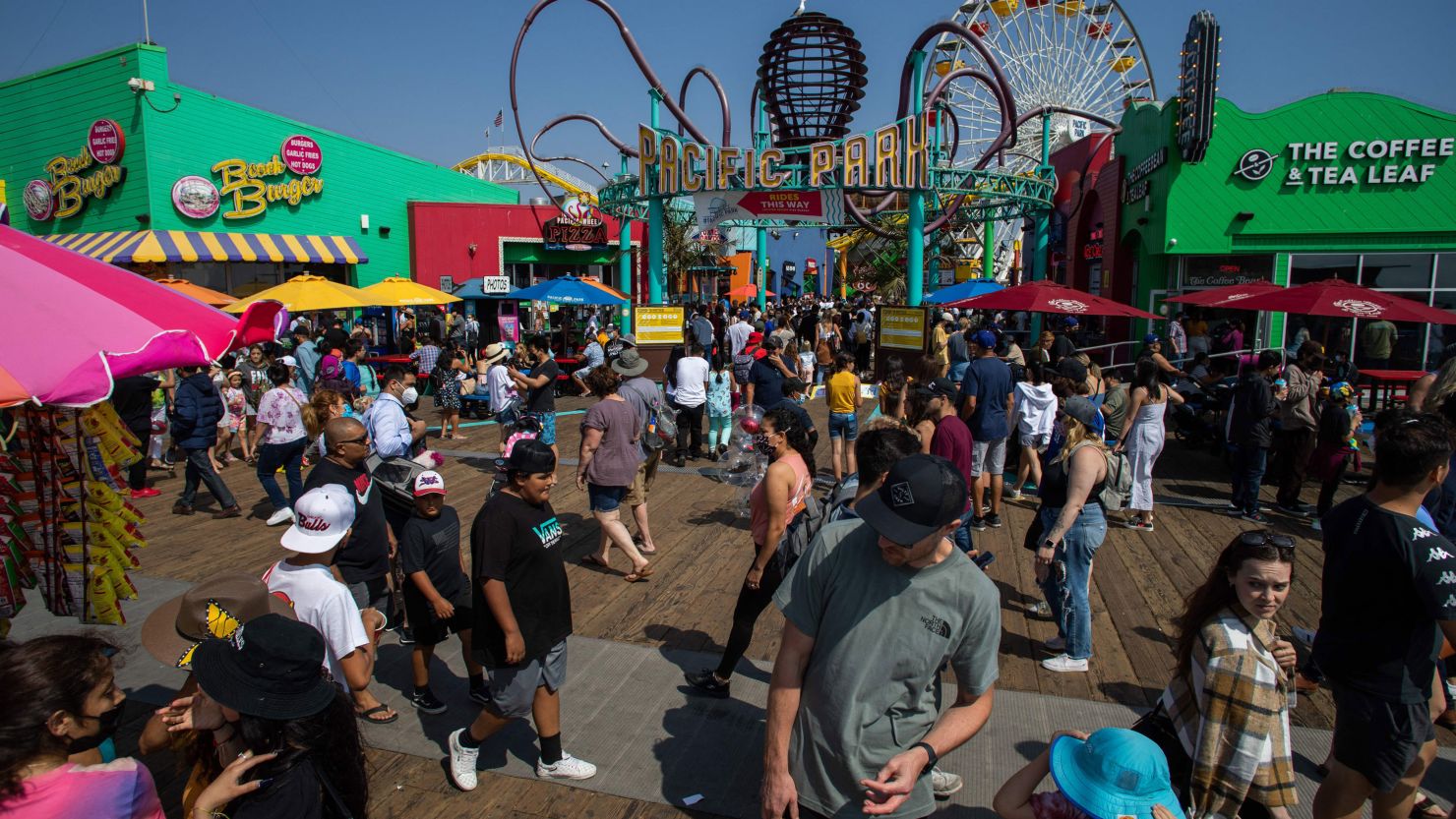 People crowd the Santa Monica Pier in Santa Monica, California, on Saturday, May 29 as Memorial Day is celebrated across the US.