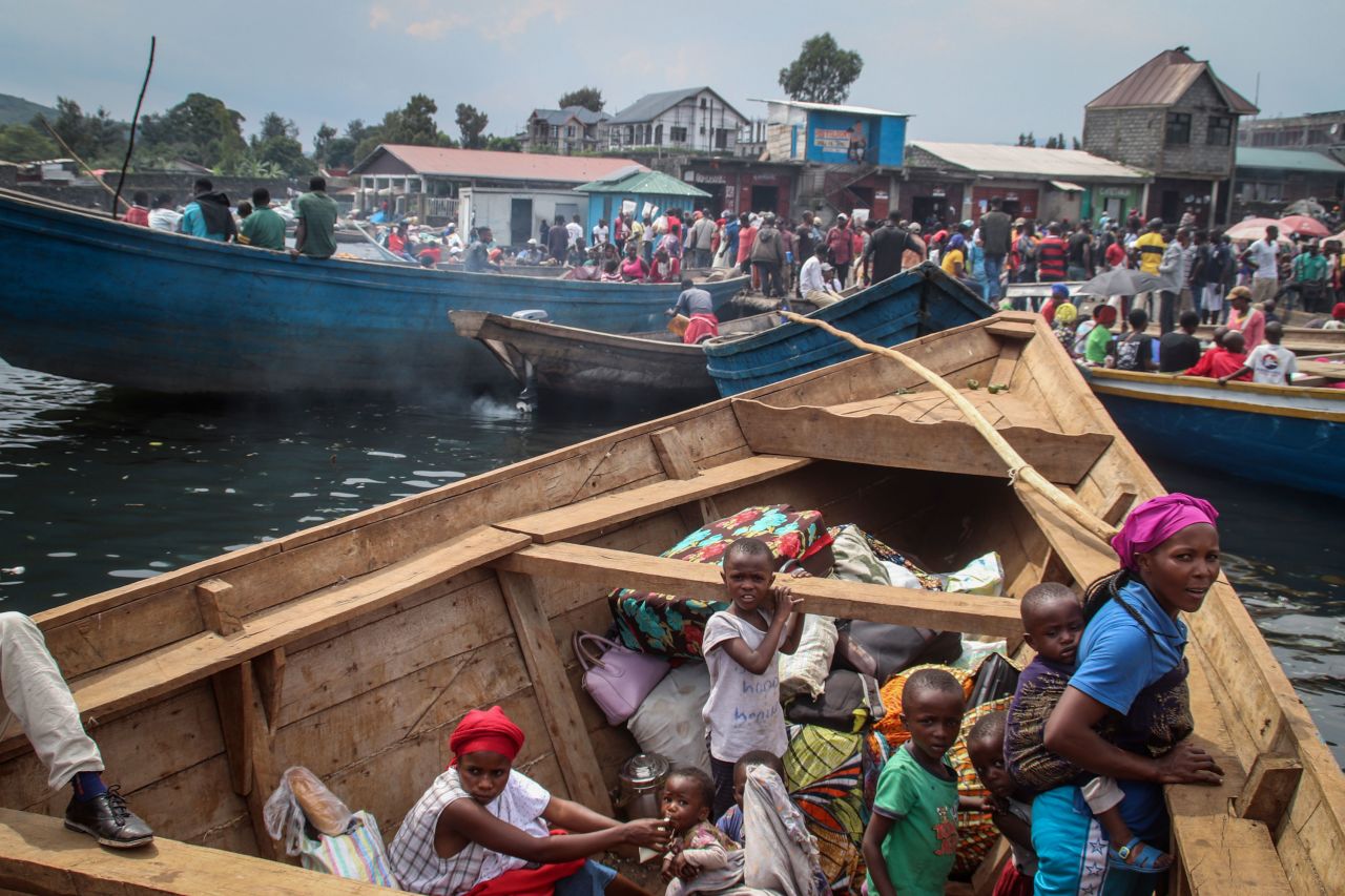 Goma residents board boats at the port of Kituku as they flee across Lake Kivu on Friday, May 28.