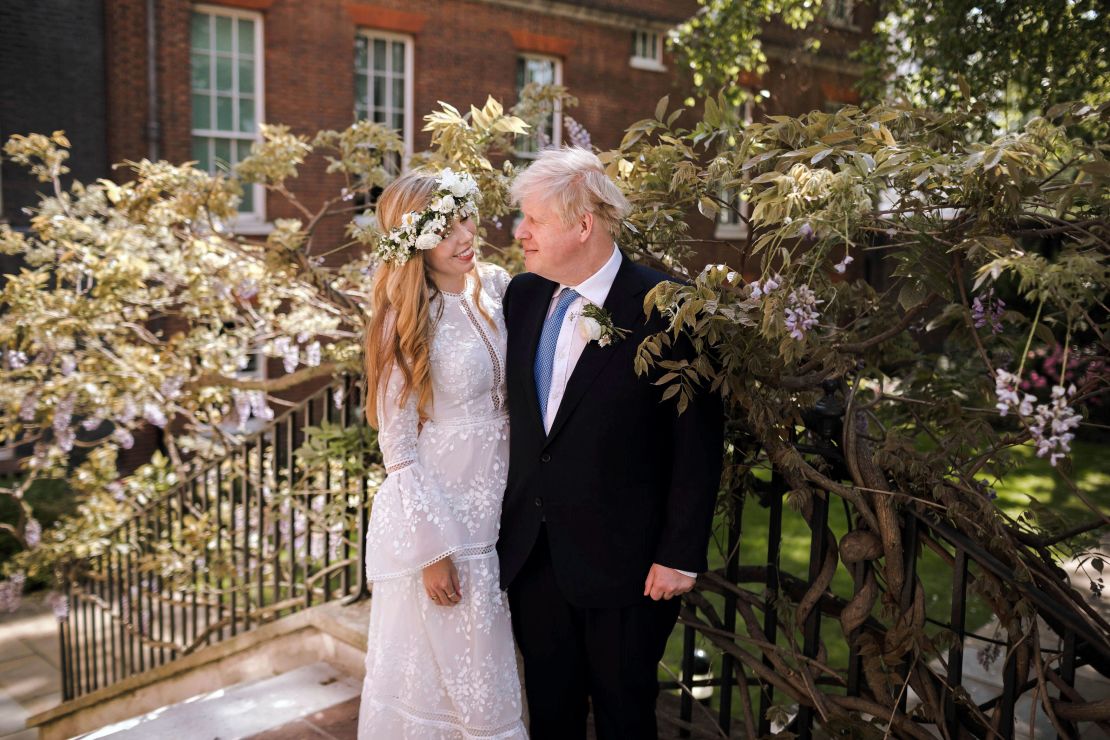Boris and Carrie Johnson pose together in the garden of 10 Downing Street after their wedding.