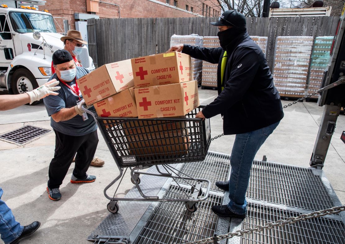 American Red Cross volunteers help move comfort kits in Houston, Texas, on Sunday February 21, 2021.