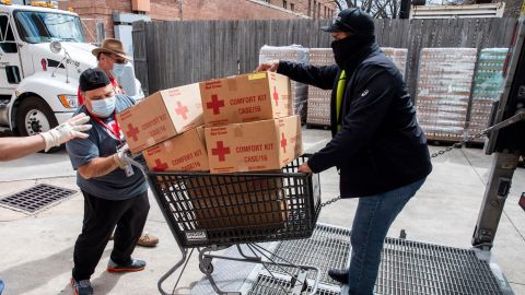American Red Cross volunteers help move comfort kits in Houston, Texas, on Sunday February 21, 2021.