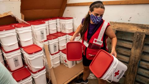 American Red Cross volunteer Casey Garnett unloads emergency cleaning kits after Hurricane Laura, in Georgetown, Louisiana, on Friday, September 4, 2020.