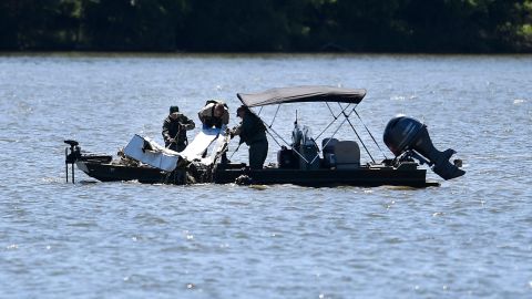 Emergency personnel remove debris of a plane crash from Percy Priest Lake in Smyrna, Tennessee, on Sunday. 