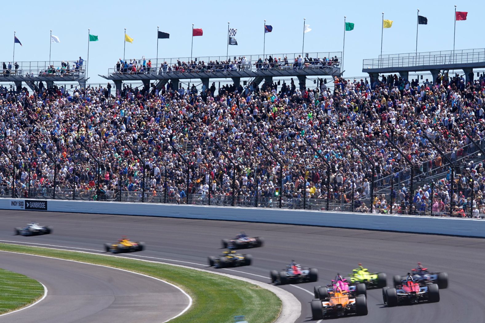 Fans watch the Indianapolis 500 auto race on Sunday. This year's event was billed as the most-attended sporting event since the pandemic's start, with the 135,000 available tickets quickly selling out.